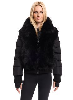 This down puffer bomber jacket is crafted from a plush faux fur and matte nylon fabric, filled with down to achieve warmth and an ultra cozy feel. The Faux fur Carlie features a stand collar, zip cuffs, spandex wrist cuffs with thumbholes, a center front zip closure, and lower zip pockets. Skiing Outfit, Wrist Cuffs, Sherpa Jacket, A Stand, Nylon Fabric, Stand Collar, Parka, Vegan Leather, Zip Pockets