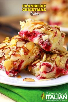 cranberry christmas cake on a plate with almonds