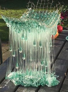 a glass sculpture sitting on top of a wooden table