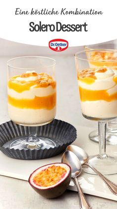 two desserts in small glasses on a table