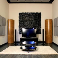 a living room with speakers and a television