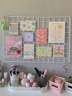 a white shelf topped with lots of greeting cards