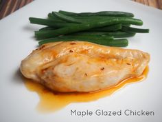 a white plate topped with chicken and green beans