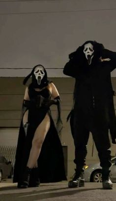 two people in costumes standing next to each other