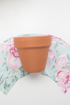 a flower pot sitting on top of a cloth