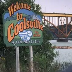 the welcome sign to coolsville is in front of a bridge