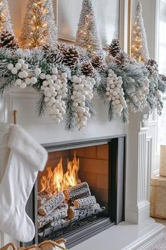 a fireplace decorated for christmas with stockings and pine cones