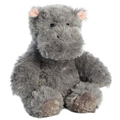 a gray stuffed animal sitting on top of a white surface