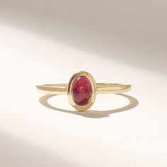 Introducing the exquisite Solid Gold Red Tourmaline Ring, a true masterpiece in the realm of fine jewelry. Handcrafted with utmost precision and attention to detail, this ring combines the timeless elegance of solid gold with the radiant allure of a bezel-set solitaire gemstone. Features * Gold KT: 10K, 14K, 18K * Custom Gold Color: Rose Gold, Yellow Gold, White Gold * Top of Band: 8.00x6.60MM * Width of Band: 1.50MM * Thickness of Band: 1.30MM * Main Gemstone: Natural Red Tourmaline * Total Ctw: 0.50 Ctw * Ready to Ship in 5-7 Business Days ✓ We care about the environment,the jewelry we cast is made with recycled gold. We source exclusively post-consumer material that is refined back to their pure elements to ensure that the gold is in the same quality. Our designs are made from 14k/18k/1 Pinky Promise Ring, Graduation Rings, October Birthstone Jewelry, Red Tourmaline, Future Engagement Rings, Pinky Promise, Tourmaline Ring, October Birthstone, Jewelry Ring