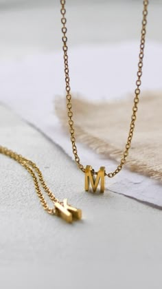 Gold initial necklaces from DrippinnnGold Initial Necklace Gold Letters Pendants, Gold Initial Necklaces, Jewelry Product Shots, Diamond Pendants Designs, Jewelry Photography Styling, Fancy Jewelry Necklace, Gold Pendant Jewelry