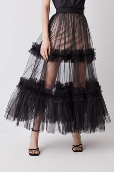 Italian Tulle Skirt/ Ruffles Skirt/ Ruffles Tulle Skirt/ Gathered Tulle Skirt/ Bridal Tulle Skirt/ Royal Skirt/ Pride Skirt/ Celeb Exude artisanal allure in this striking tulle maxi skirt. Featuring a tiered design which flares out with bountiful drama, this piece promises to make an unforgettable impression. Sheer tulle material adds a sultry element which can be emphasised when paired with a bodysuit, or juxtaposed with a tailored blazer. Sheer tulle fabric Tiered design Maxi hemline XS----BUS Pride Skirt, Royal Skirt, Skirt Ruffles, Ruffles Skirt, Coachella Style, Tulle Material, Tulle Maxi Skirt, Sheer Skirt, Tailored Blazer