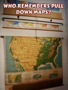 a map hanging on the wall with words that read who remembers pull down maps?