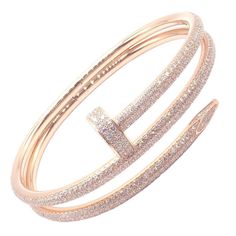 About This Piece: The Cartier Juste un Clou Nail Bangle is an exquisite bracelet crafted in 18k rose gold, adorned with sparkling diamonds. Shaped like a bent nail, it epitomizes bold elegance. This size 16 piece comes with papers, ensuring... Cartier Nail Bracelet, Cartier Diamond Bracelet, Rose Gold Nail, Cartier Juste Un Clou, Nail Bangle, Chanel Ring, Nail Bracelet, Nail It, Gold Nail