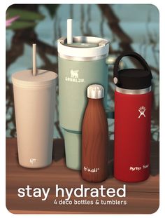 various types of water bottles and tumblers sitting on a table with the words stay hydrated