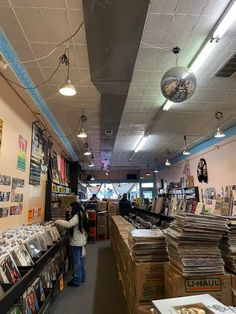 the inside of a record store filled with records