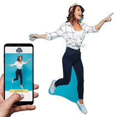 a person holding a cell phone with an image of a woman jumping in the air