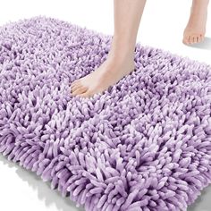 a person standing on top of a purple rug with their feet in the air and one foot sticking out