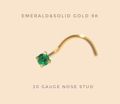 the emerald nose stud is shown in gold