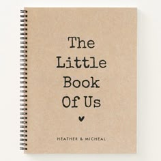 the little book of us is written in black ink on a brown spiral notebook cover