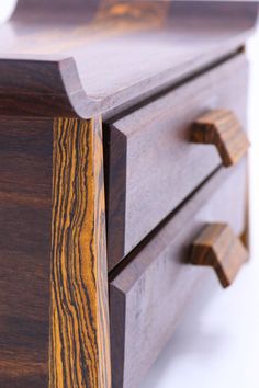 a close up of a wooden dresser drawer