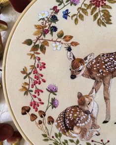 two fawns and flowers are depicted in this embroidery pattern