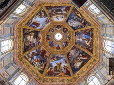 an ornate ceiling with many paintings on it