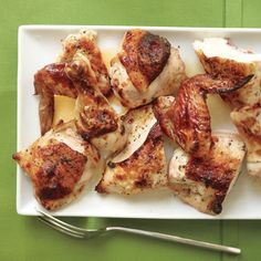 chicken wings and cheese on a plate with a fork