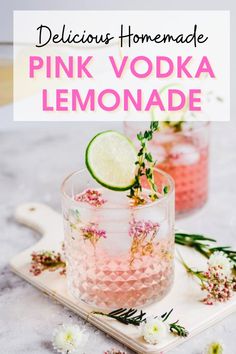 pink vodka lemonade with flowers and lime on the side