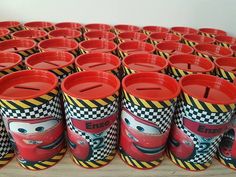 there are many cups with cars on them