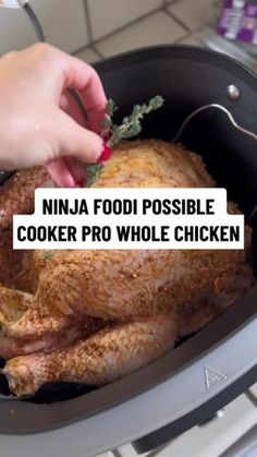 someone is cooking a whole chicken in a pan with the words ninja food possible cooker pro whole chicken