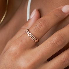 SAIGE RING Our unique Saige Name Ring features a set of special initials or a short name, woven into a curb chain band. You have the option to add a glistening heart, &, or star symbol, studded with cubic zirconia stones, for an extra-special touch. It's the perfect way to keep a special word, a short name, your birth year, or your initials close to your heart, and is sure to be a treasured keepsake for years to come. *RELATED PRODUCTS -- For a dainty cursive name ring: https://etsy.me/4dvjo1C *MATERIAL -- Cubic Zirconia Stones: On the symbols only -- 100% Recycled Sterling Silver: An everlasting classic that'll look as good as new with continuous care. -- 18K Gold Vermeil: Sterling silver base, plated with a durable and thick layer of 18-karat gold vermeil. -- 18K Rose Gold Vermeil: Sterl Name Jewelry Personalized, Word Ring, Star Symbol, Name Ring, Letter Ring, Name Rings, Special Words, Birth Year, Name Jewelry