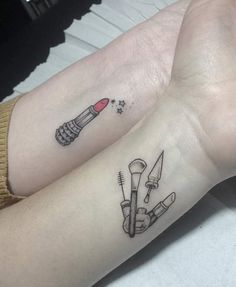 two people with matching tattoos on their arms