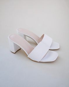 Classic satin slip on block heel sandals for casual and dressy look. Simple and easy wear for bridal wear, bridesmaids, holiday party, wedding parties, and any special occasions. DETAILS: HEEL HEIGHT: 2.5 InchesCOLORS AVAILABLE: Ivory and WhiteUPPER: Synthetic upper and liningMATERIALS: Manmade outsole Bridesmaids Sandals, Classic Wedding Shoes, White Sandals Wedding, Bachelorette Dresses, Bridesmaid Sandals, Es Shoes, Women Wedding Shoes, Pearl Heels, Wedding Shoes Sandals