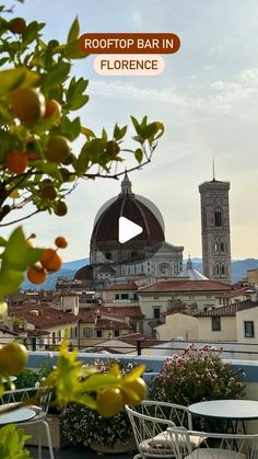 rooftop bar in florence with view of the dome and bell tower behind it