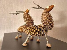 two pine cones are made to look like animals