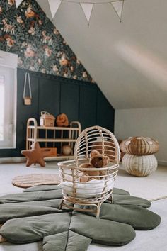 a room that has some kind of chair on the floor in front of an attic