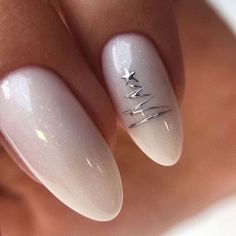 A modern and sleek nail design that showcases a silver Christmas tree on a soft white base. The ombre effect and fine silver lines add depth and dimension, creating a contemporary holiday look. The simple yet striking design makes these nails perfect for anyone seeking a polished and elegant manicure for the festive season. Tree Nails, Casual Nails, New Year's Nails, Neutral Nails, Nude Nails, Nail Manicure