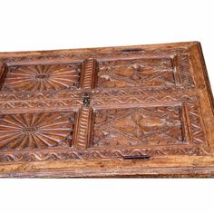 an old wooden box with intricate carvings on it