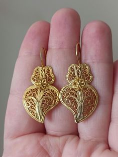 Lovely hand-crafted filigree Viana Heart shaped hook earrings, very traditional in the Minho region of Portugal. In Gold Vermeil, hallmarked, (made in Solid 925 Sterling Silver, with Goldplating). They are brand new with a very pretty Filigree design! Handmade, 3.8cm long They will be send with Polishing Cloth and Certificate of Authenticity, in our Jewellery Box! 📌 Only this pair available!  PS. For Public Health reasons we will not accept returns or exchanges of earrings or piercings. Thank y Sterling Silver Heart Earrings, Silver Heart Earrings, Filigree Earrings, Filigree Design, Bling Rings, Sterling Silver Heart, Hook Earrings, Heart Earrings, Silver Heart