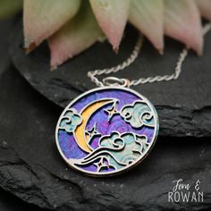 This Crescent Moon and Cloud Pendant Necklace is a beautiful gift for those enchanted with the night sky!  This necklace features a Stainless Steel and Brass disk that have been carefully handmade and painted in our studio. This style of Crescent Moon and Cloud symbol is used in many ancient cultures to represent motherhood and stability. It is also used as a sign of growth, creativity, and manifestation. This beautiful necklace has an eye-catching appearance that would look great with any outfi Whimsical Moon-shaped Jewelry Gift, Spiritual Moon Print Jewelry Gift, Magical Sun And Moon Design Necklace Gift, Star Jewelry, Ancient Cultures, Crescent Moon, Stars And Moon, Silver Wire, Beautiful Necklaces