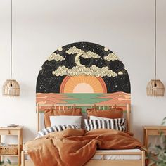 a bed with an orange comforter and pillows in front of a painting on the wall