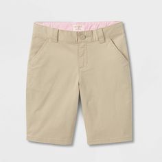 These Uniform Chino Shorts from Cat and Jack™ make a comfy, stylish and practical addition to your kid's shorts collection. Made from cotton with a hint of spandex for soft, stretchy comfort, these shorts are designed in solid khaki that makes them easy to pair with a variety of tops. They're cut to an above-knee length in a regular fit and have a fly snap and zipper closure, and the front and jetted pockets provide your child with space to stash toys and other small items. Cat and Jack™: Classi