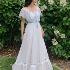 "1970s Gunne Sax wedding dress with floral embroidery and a scalloped edge. Tiered ruffle skirt with blue satin ribbon and lace trim. Can be worn on or off the shoulder. Fully lined, zips in the back. Size Estimate: Small Measurements Bust: 35\" / Waist: 26\" / Length: 51\" Condition Excellent, with a couple very faint marks at hem when closely inspected. Follow @willavintage on Instagram --------------------------------------------------------------------------------------- All items are vintag Vintage Ruffled Dresses For Wedding Night, 1970s Prom Dress, Gunne Sax Wedding Dress, 70s Wedding Dress, Confirmation Dresses, Dress With Floral Embroidery, Sax Dress, Gunne Sax Dress, Tiered Ruffle Skirt