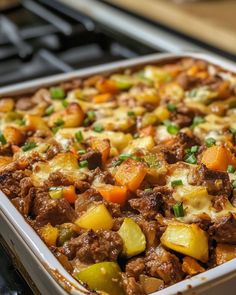 a casserole dish filled with meat and vegetables