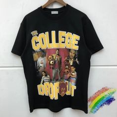 the college dropout t - shirt is hanging on a wall