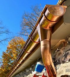 a large metal pipe sticking out of the side of a building