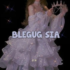 a woman in a white dress with a tiara on her head and the words bleug sia