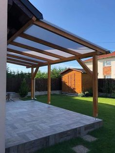 an outdoor patio with a pergolated roof