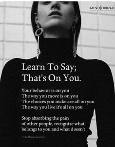 a woman in black shirt and earrings with words on the back saying learn to say, that's on you