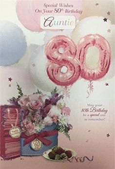 an 80th birthday greeting card with balloons and flowers in a gift box on the table